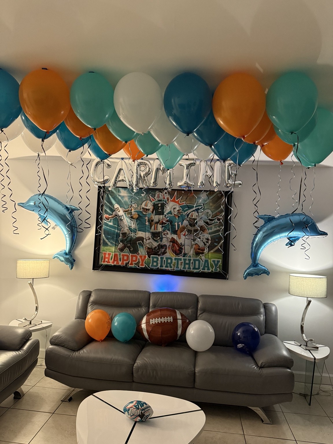 Teal, orange and white balloons turn a favorite team into a personal birthday surprise.
