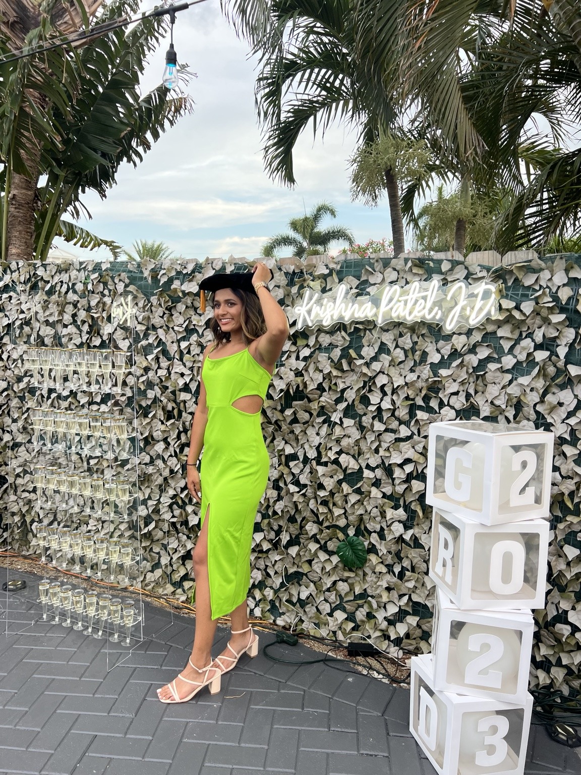 A proud graduation moment, a personalized backdrop and a toast to everything that comes next.